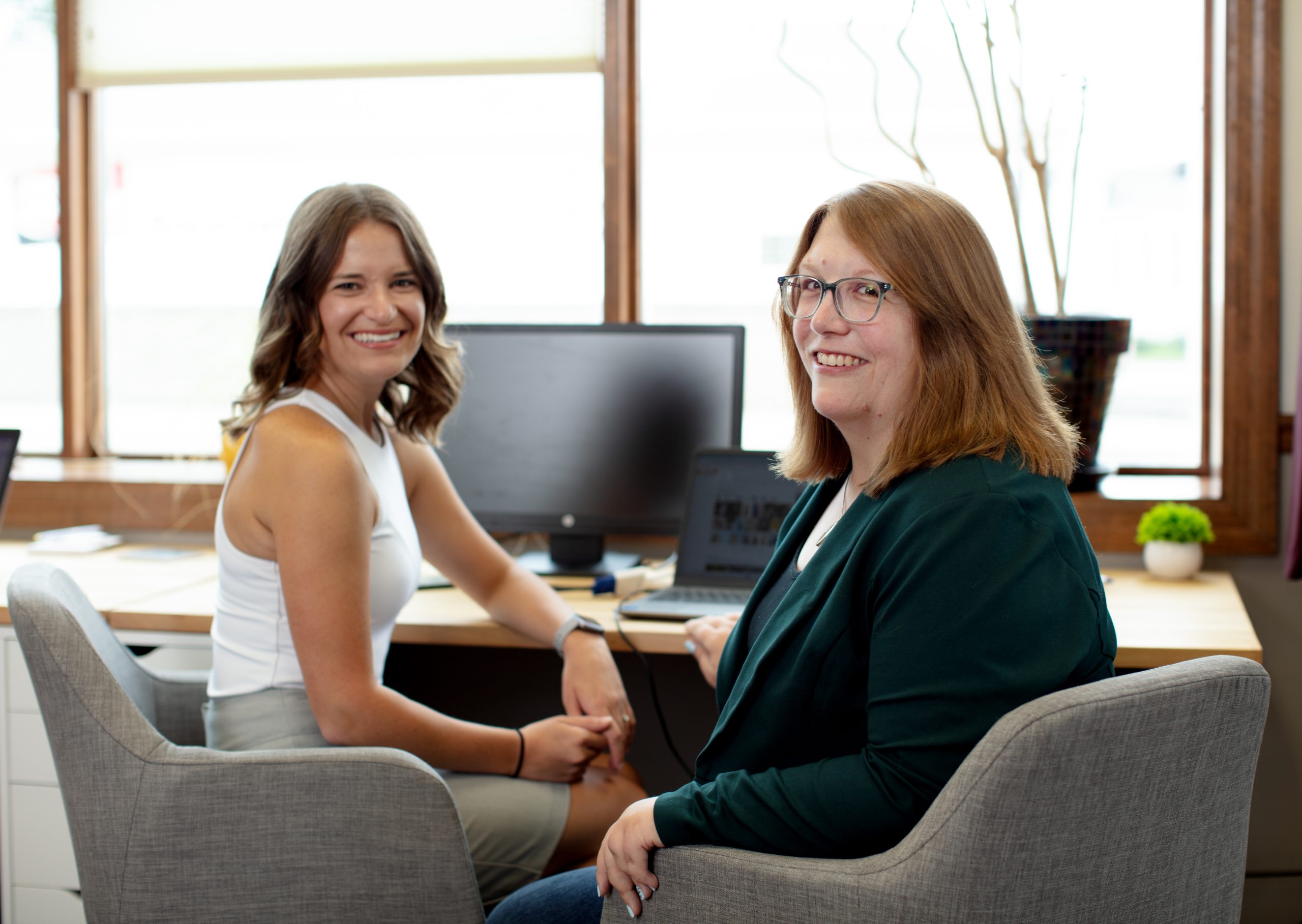 Photo of Emily Zelinski and Emily Miels in the office together