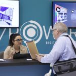 Adrian Bredeson helping a client at a trade show