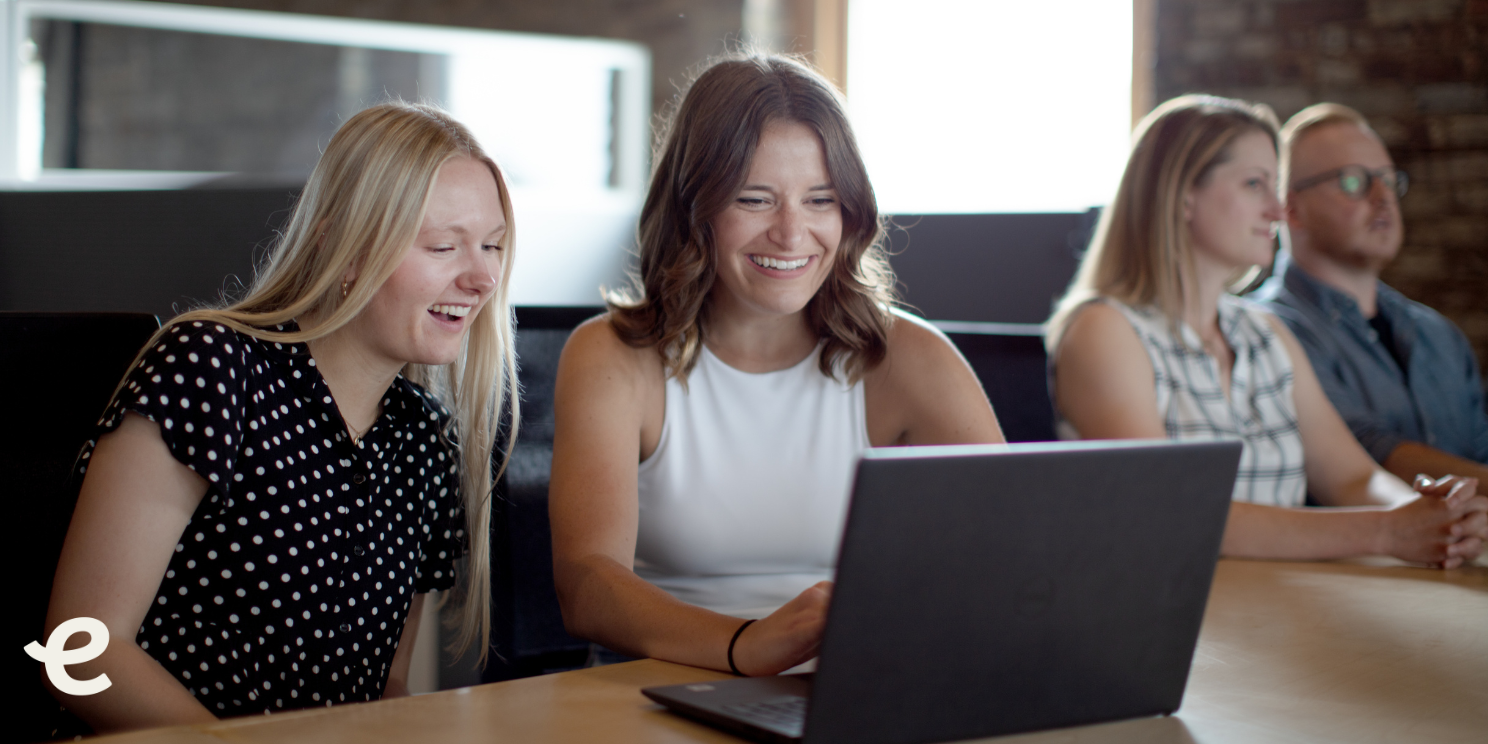 1 Photo of two women collaborating in an office setting
